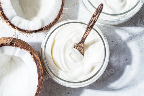 Preview: Vegan coconut yogurt in glass jars, white background, top view. Vegan food concept.