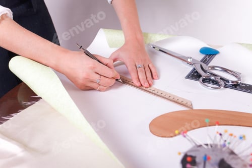 Preview: The seamstress makes a pattern for the future product. Sewing workshop.