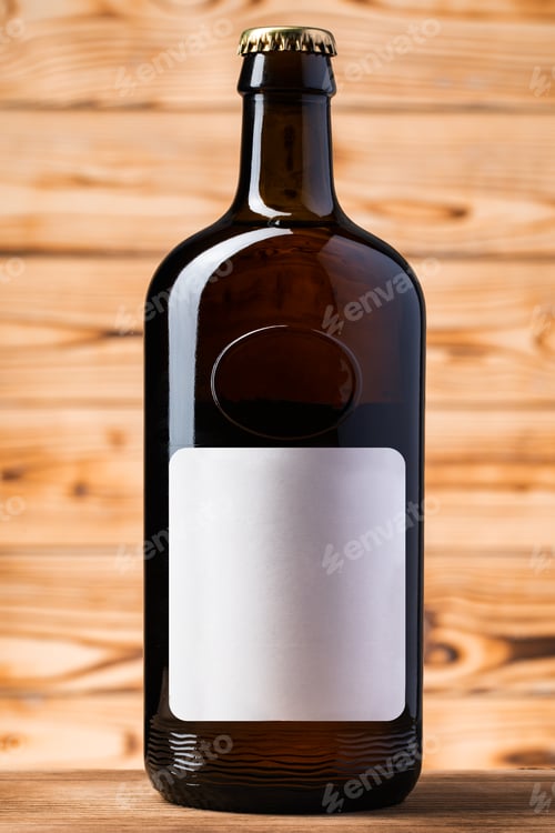 Preview: Blank label on the beer bottle on wooden background.