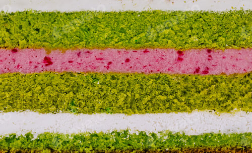 Preview: Delicious pistachio cake layers showing filling and frosting