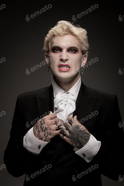 Preview: Creative young man showcases dramatic Halloween costume with bold makeup and unique style