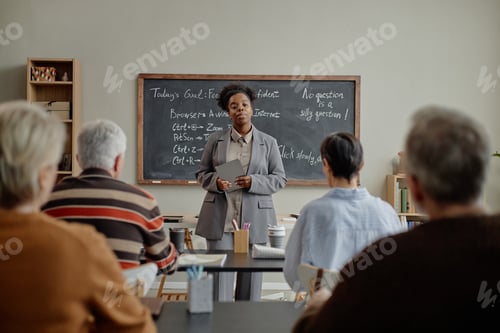 Preview: Middle Aged Black Woman Teaching Diverse Adult Students in Classroom Setting