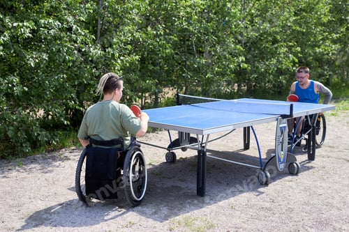 Preview: Portrait of two young people with disabilty playing table tennis