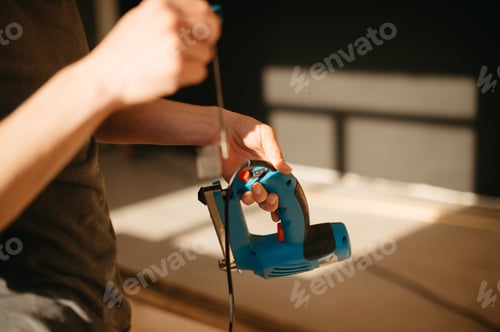 Preview: nailer close up in man's hands, home improvement, renovation, inside, house, new beginnings