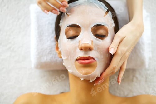 Preview: Beautiful Young Girl with Mask on Face. Beauty Salon and Skin Care.