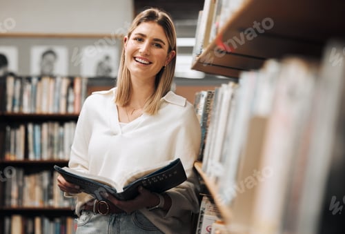 Preview: Student, reading or books in library on school, university or college campus for education, study r