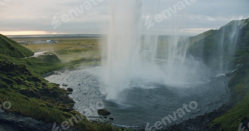 Preview: Backlit by sunset Seljalandfoss waterfall Iceland