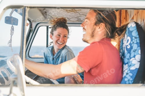 Preview: Happy couple inside a vintage minivan making a roadtrip