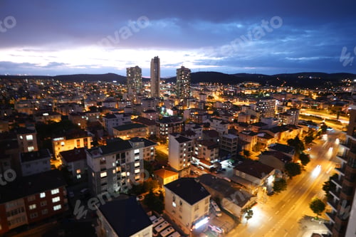 Preview: A Stunning Cityscape at Dusk showcasing Illuminated Streets along with High Rises and more