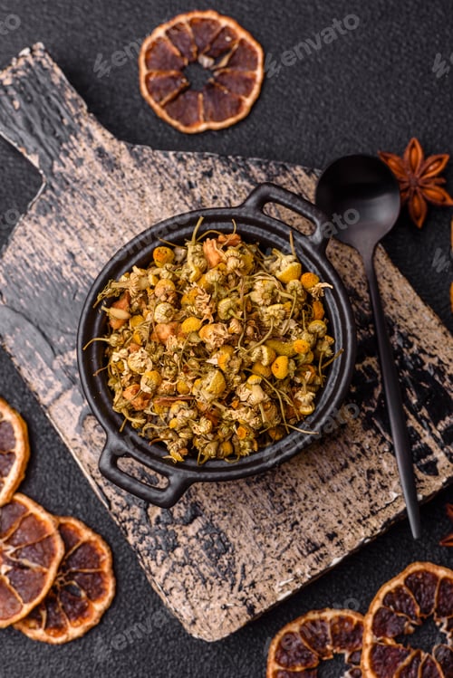 Preview: Dried chamomile flowers, herbal tea in a bowl for a hot morning drink. Dried chamomile