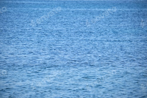 Preview: Closeup seascape surface of blue sea water with small ripple waves.