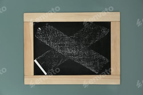 Preview: Small dirty chalkboard hanging on color wall
