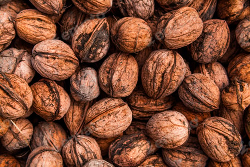 Preview: Background of walnuts. Many nuts