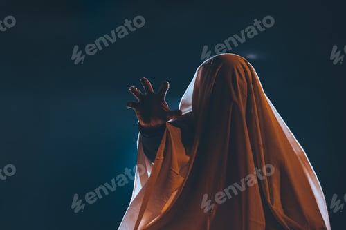 Preview: Halloween concept with ghost in smoky night