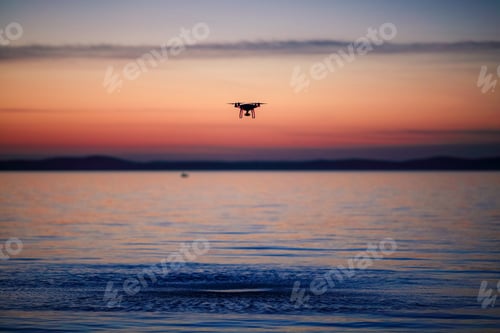 Preview: The flying drone at sunset on the sea