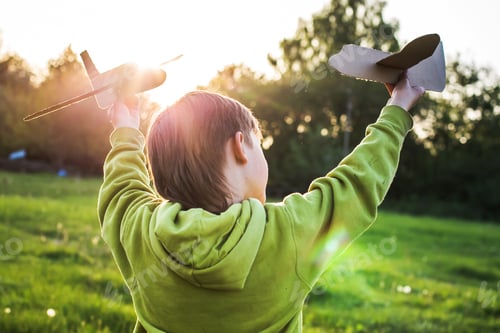 Vista previa: Boy play with homemade toys in summer. Children without gadgets. The brothers who invented games out