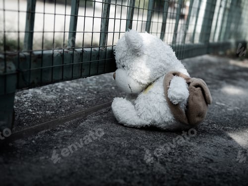 Preview: Teddy Bear sitting on Cement Vintage Styles,Symbols Abuse Child kid