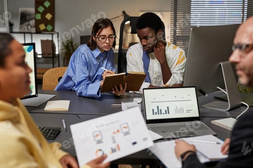 Preview: Team of Business People Working at Night