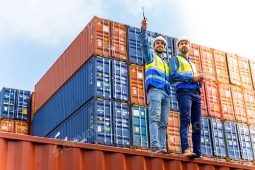 Preview: Two male engineers in a container shipping company Consulting