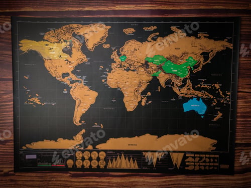 Preview: The world map placed on a wooden table