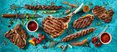 Preview: Appetizing grilled meat steaks placed on table