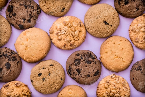 Preview: Delicious Assorted Cookies on a Purple Background