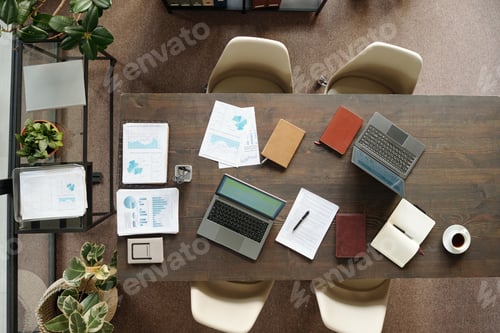 Preview: Top View of Laptops and Documents Arranging on Office Table during Meeting