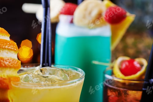 Preview: bright beautiful bright glass of alcoholic cocktail or lemonade on a table in a bar. soft focus.