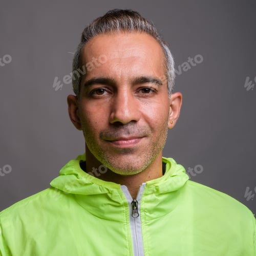 Preview: Handsome Persian man with gray hair wearing jacket