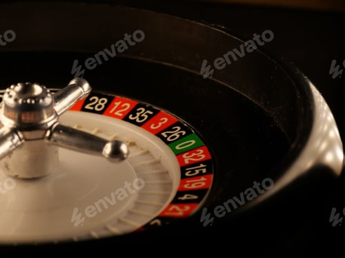 Preview: Closeup shot of a luxury casino roulette wheel on a black background