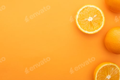 Preview: top view of juicy whole oranges and slices on colorful background