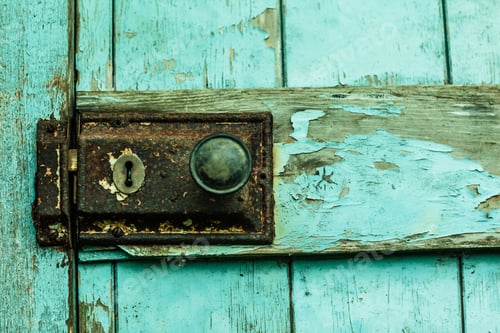 Preview: Close up of rusty lock on blue chipped rustic door
