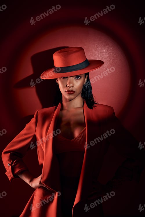 Preview: Spotlight, red suit and woman with fashion from 90s, elegant clothes and vintage on a studio backgr