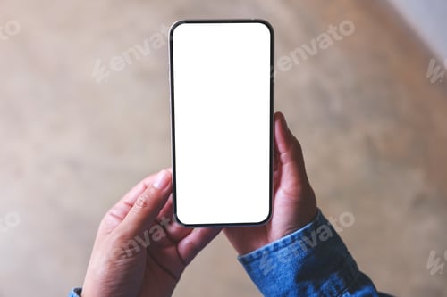 Preview: Top view mockup image of a woman holding mobile phone with blank desktop screen