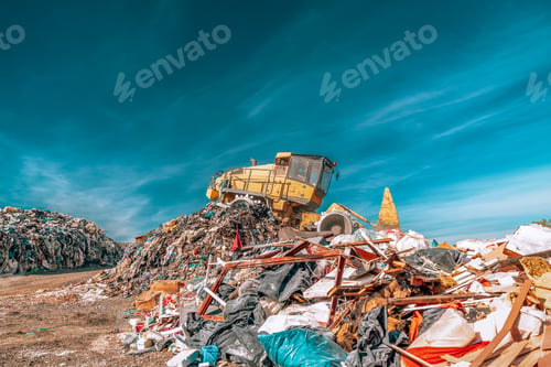 Preview: bulldozer compactor working at a landfill.