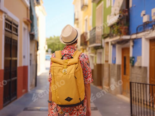 Preview: Woman strolls through colorful streets of Spanish coastal town