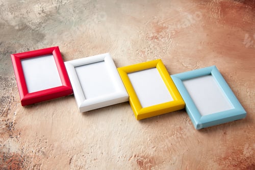 Preview: Front view of four photo frames hung on side by side on mix color wall with free space