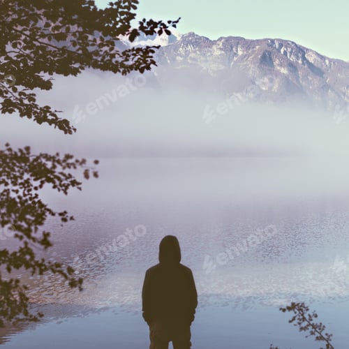 Preview: Man tourist in thick fog on the lake enjoying life.