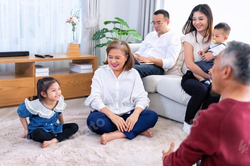 Preview: The family have fun relax engaged in fitness yoga at home using online instruction from laptop