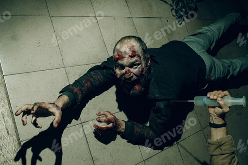 Preview: Zombie in the Halloween dark with syringe