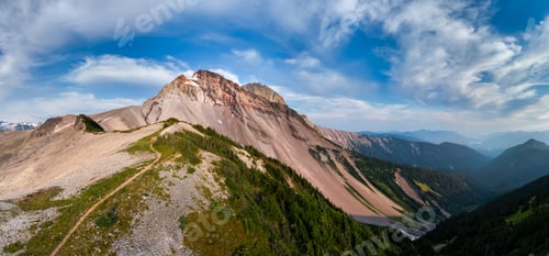 Preview: Panoramic View of Rugged Mountain in BC, Canada Surrounded by Green Valley