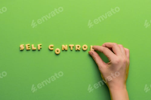 Preview: self controt concept, person making words of cookies isolated on green. healthy lifestyle and