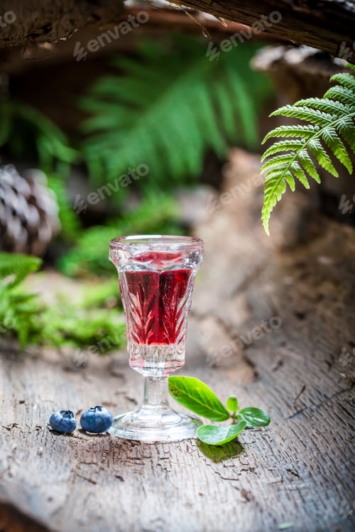 Preview: Strong liqueur with alcohol and blueberries