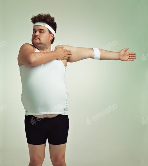 Preview: Stretching is important. Overweight man doing arm stretches.