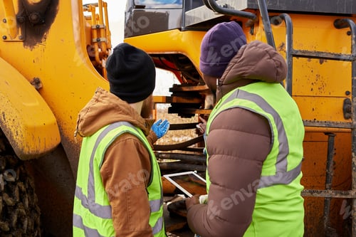 Preview: Mechanics Inspecting Truck Outdoors