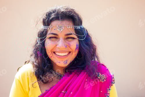 Preview: Portrait of young Indian face in paint Woman in traditional indian pink outfit with jeweler