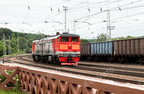 Preview: electric train rides on rails at a small railway station