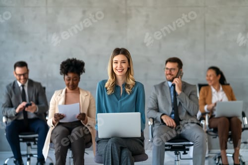 Preview: Multicultural professional businesspeople working together on research plan in boardroom.