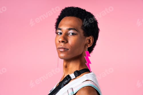 Preview: Fashionable fluid gender man posing in studio