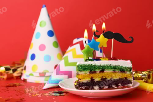 Preview: Piece of birthday cake with candles on red background, space for text